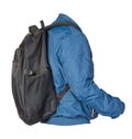 Black backpack dressed in a blue jacket isolated on a white background Royalty Free Stock Photo