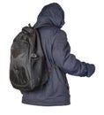 Black backpack dressed in a blue jacket isolated on a white background Royalty Free Stock Photo