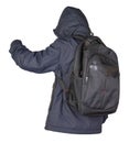 Black backpack dressed in a blue jacket isolated on a white background Royalty Free Stock Photo