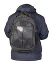 Black backpack dressed in a blue jacket isolated on a white background Royalty Free Stock Photo