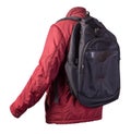 Black backpack dressed in a red jacket isolated on a white background Royalty Free Stock Photo