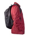 Black backpack dressed in a red jacket isolated on a white background Royalty Free Stock Photo