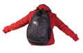 Black backpack dressed in a red jacket isolated on a white background Royalty Free Stock Photo