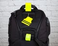 Black backpack with pedestrain safety reflectors Royalty Free Stock Photo