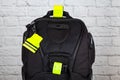 Black backpack with pedestrain safety reflectors Royalty Free Stock Photo