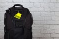 Black backpack with pedestrain safety reflectors with copy space Royalty Free Stock Photo