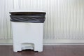Black bag plastic in white trashcan Royalty Free Stock Photo