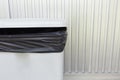 Black bag plastic in white trashcan Royalty Free Stock Photo