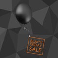 Black balloon on black polygonal background with inscription fo
