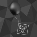 Black balloon on black polygonal background with inscription fo