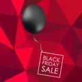 Black balloon on red polygonal background with inscription for