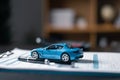 Black ballpoint pen, calculator and blue car on paper form, Blur with office background, out of focus, Protecting and after-sales Royalty Free Stock Photo