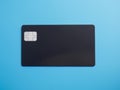 Black bank card on blue background isolated AI