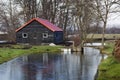 Black barn with a red roof