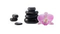 Black basalt stones for hot massage with  orchid flower  isolated on white Royalty Free Stock Photo