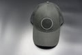 Black baseball cap with round space for logo. Top front view, isolated on gray background Royalty Free Stock Photo