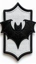 Black Bat Silhouette on a White Embossed Patch with Decorative Border Details Royalty Free Stock Photo