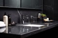 Black bathroom interior design, undercounter washbasin with black marble counter, modern luxury minimalist masculine washroom. Royalty Free Stock Photo