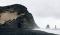 Black Beach Vik in Iceland. Waves of the Atlantic Ocean. Basalt pillars on the coast. Royalty Free Stock Photo