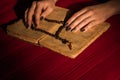 Black bead rosary on the old opened holy bible book. Royalty Free Stock Photo