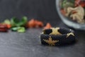 Black beaded bracelet with golden stars