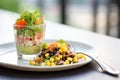 black bean burger with corn salsa on a glass dish