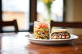 black bean burger with corn salsa on a glass dish Royalty Free Stock Photo