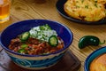 Black Bean Chili Con Carne in Bowl with Corn Bread Royalty Free Stock Photo