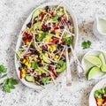 Black bean salad. Salad with corn, beans, avocado and tortilla. On a light background Royalty Free Stock Photo