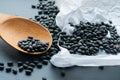 Black bean on a wooden spoon Royalty Free Stock Photo