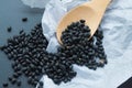 Black bean on a wooden spoon Royalty Free Stock Photo
