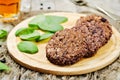 Black beans brown rice walnut oat burgers with spinach Royalty Free Stock Photo