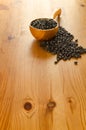 Black beans on wooden background Royalty Free Stock Photo