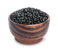 Black beans in wooden bowl isolated on white background Royalty Free Stock Photo