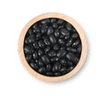 Black beans in wooden bowl isolated on white background. Top view Royalty Free Stock Photo