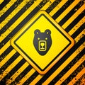 Black Bear head icon isolated on yellow background. Warning sign. Vector Royalty Free Stock Photo