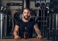 Black man manufacturer presenting craft beer in the microbrewery. Royalty Free Stock Photo