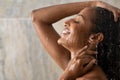 Black beautiful girl relaxing in the shower