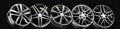 black beautiful sports alloy wheels forged stand in a row on a black background Royalty Free Stock Photo