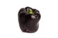 Black bell pepper isolated in white background