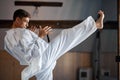 Black belt karate fighter training hight kick Royalty Free Stock Photo