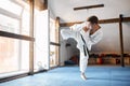 Black belt karate fighter training hight kick Royalty Free Stock Photo