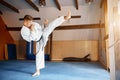 Black belt karate fighter training hight kick Royalty Free Stock Photo