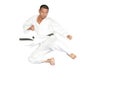 Black belt karate man jumping to give a high kick Royalty Free Stock Photo