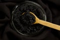 Black Beluga caviar jar on wooden background