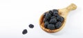 Black berries on a white background. Forest fruits like blackberries in an olive dish with a handle. View from above. Banner photo Royalty Free Stock Photo