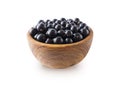 Black berries on white. Blackcurrants in a wooden bowl isolated on white background. Blackcurrant isolate. Blackcurrants isolatedB