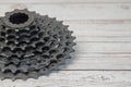 Black bicycle cassette on wooden background. Close-up Royalty Free Stock Photo