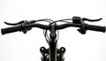 Black bicycle handlebars and front fork isolated on white background. Control levers and grips are visible. Front suspension and Royalty Free Stock Photo
