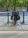 Black bicycle with panniers and ancient box on a Paris Street